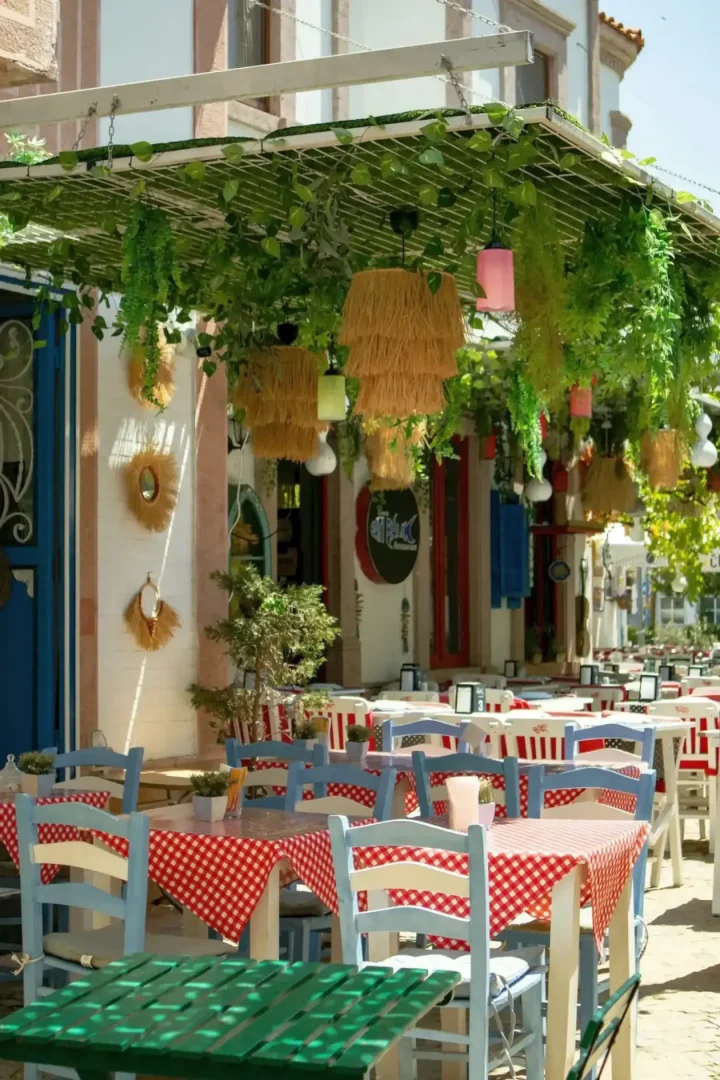 Open-air cafe courtyard. Greece’s timeless social culture -- Azzurytt Local Charm